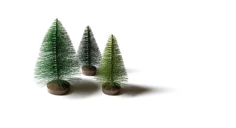 Small artificial Christmas trees isolated on a white background.  Stock Photos
