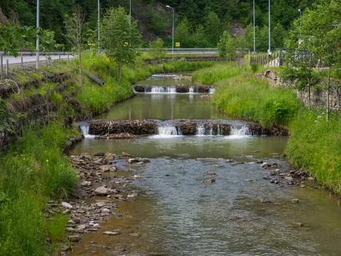 Small artificial river cascade with rocks Stock Photos