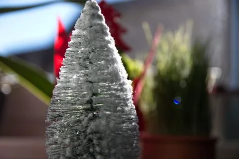 A small artificial tree with snow on it Stock Photos