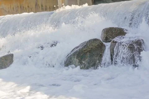 Small artificial water fall from water treatment pland. Water coming out from Stock Photos