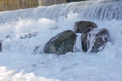 Small artificial water fall from water treatment pland. Water coming out from Stock Photos