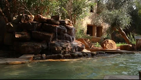 Small artificial waterfall and pool (dark version) Stock Footage 2774649