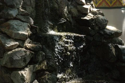 Small artificial waterfall Stock Photos
