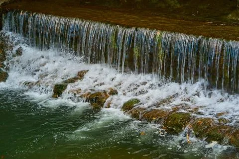 Small artificial waterfall Stock Photos