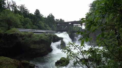 Small artificial waterfall runs fast Video stock 244803335