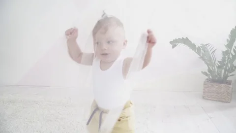 Small baby boy playing hide and seek with his mom Stock Footage 73626306
