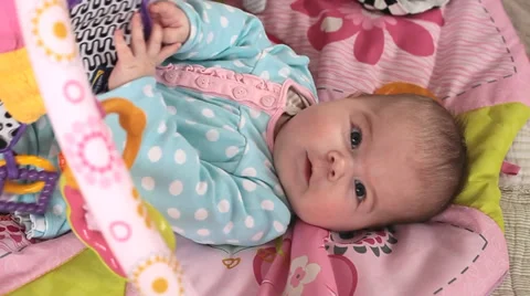 Small baby playing in a bed Stock Footage 36646700