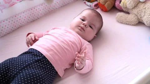 Small baby playing in a bed Stock Footage 36646767