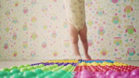 Small baby takes his first steps Stock Footage