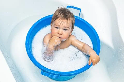 Small baby taking a bath Foto stock
