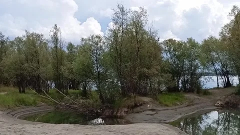 A small backwater connected by a canal to the river bed, Stock Footage 318117371