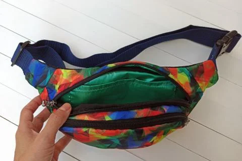 Small bag with two compartments, multicolored with green lining. Stock Photos