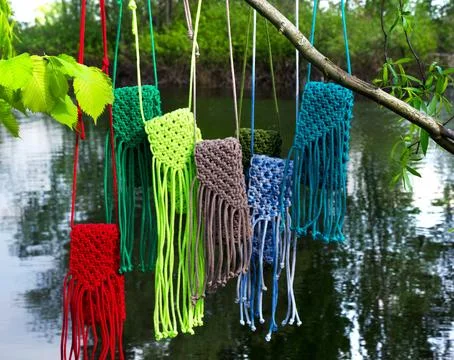 Small bags knitted with macrame technique. Stock Photos