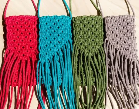 Small bags knitted with macrame technique. Stock Photos