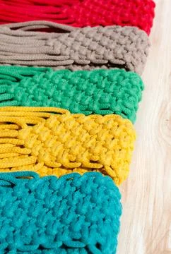 Small bags knitted using the macrame technique from cotton cord. Stock Photos