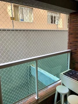 Small balcony with protective screen Stock Photos