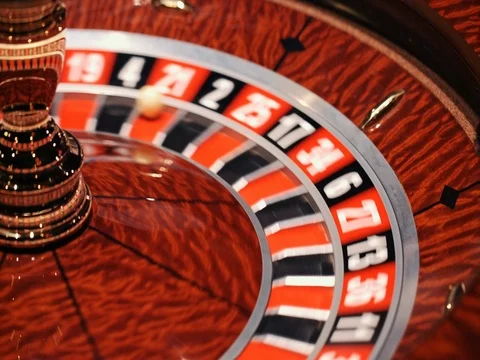 The small ball falls into the slot as the Roulette Wheel spins Stock Footage 73589120