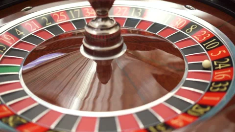 The small ball falls into the slot as the Roulette Wheel spins. follow the ring Stock Footage 197366355