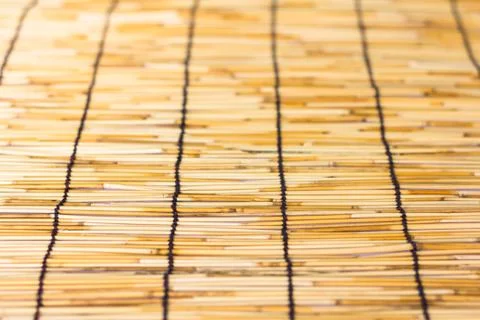 Small bamboo lined with a rope. Used for curtain Stock Photos