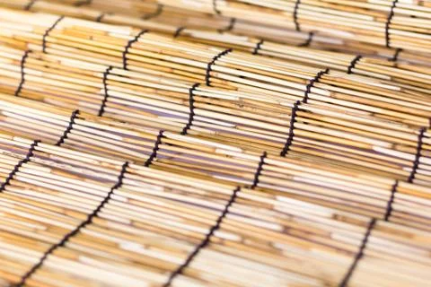 Small bamboo lined with a rope. Used for curtain Stock Photos