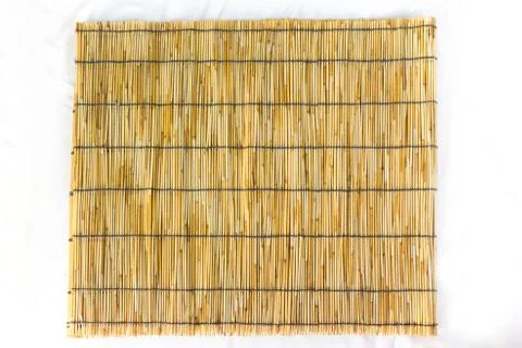 Small bamboo lined with a rope. Used for curtain Stock Photos