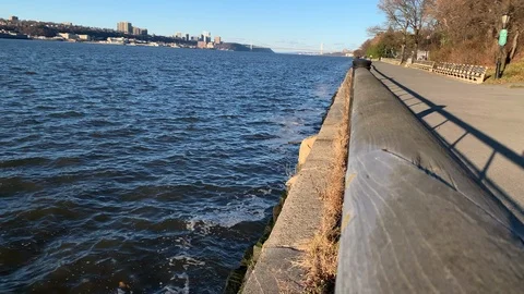 The small barrier between the Hudson River and riverside trail in New York City Stock Footage 121844567