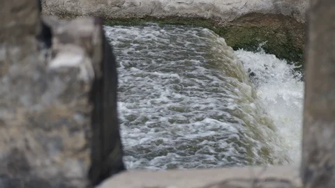 Small basic concrete lake dam to river. old dam in countryside . Slow motion  動画素材 114352459