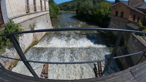 Small basic concrete lake dam to river. old dam in countryside. fisheye lens Vídeo Stock 114378440