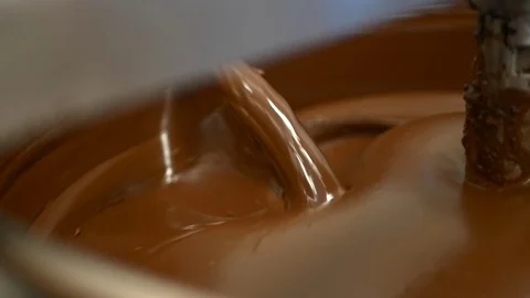 Small-batch, hand-crafted chocolate blending in large bowl. Stock Footage 100646231