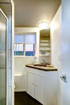 Small bathroom interior with cabinet Stock Photos