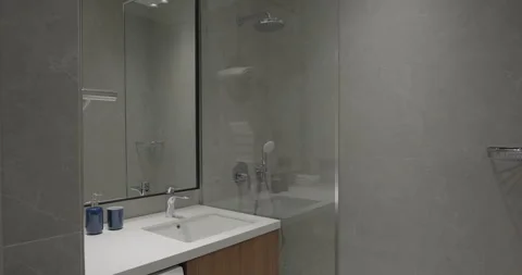 Small bathroom interior decorated with washing machine. Bathroom minimalist Stock Footage 275982979