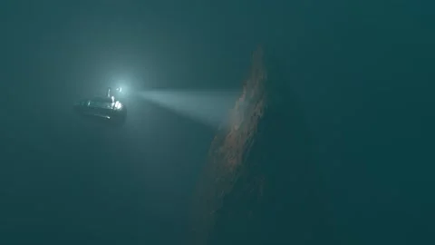 A small bathyscaphe explores sunk ship on the bottom of the sea 3d animation Stock Footage 196795456