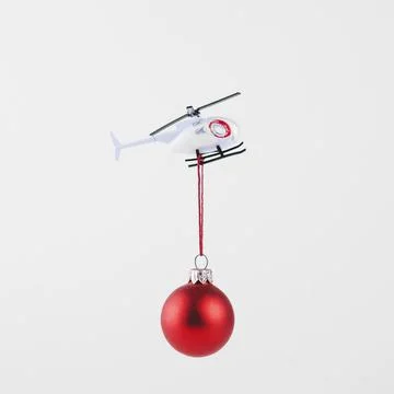 Small bauble hanging flying helicopter. High quality and resolution beautiful Stock Photos