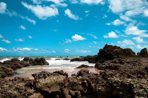 Small bay formed between the rocks. Stock Photos