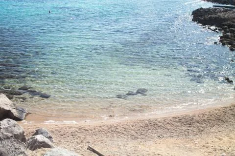 Small beach among the cliffs seen from above Stock Photos
