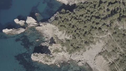Small beach and rocky cliffs, aerial drone footage of a Mallorca, Raw in 4K. Stock Footage 89893234
