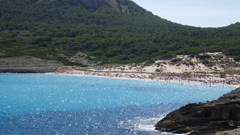 Small beach between the mountains  in Cala Mesquida Mallorca Spain Video stock 81047127