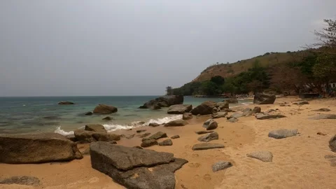 Small beach on the shore of which there are large stones. Stock Footage 242167372