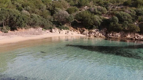 Small beach with transparent water Stock Footage 128927778