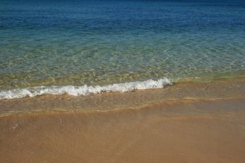 Small beach wave Stock Photos