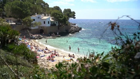 Small beach with white house Stock Footage 128348448