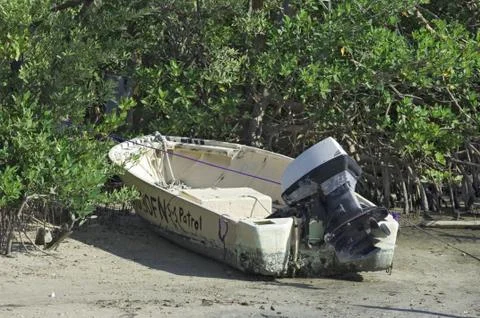 Small beached motorboat Stock Photos