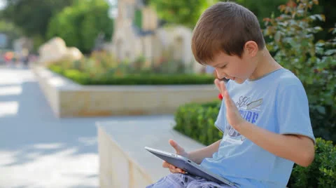Small, beautiful boy talking on the internet Stock Footage 25303239