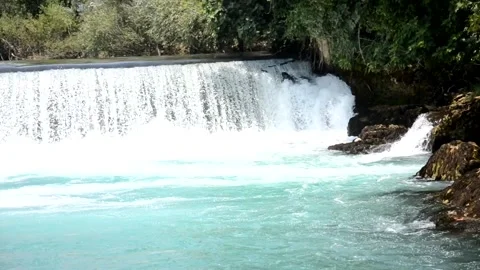 Small beautiful waterfall inside forest in the park Stock Footage 133342260