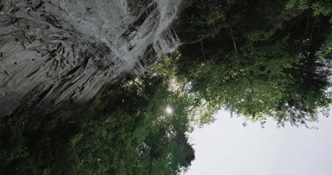 Small beautiful waterfall in mountains. Action. Gentle waterfall flowing dow Stock Footage 159177703