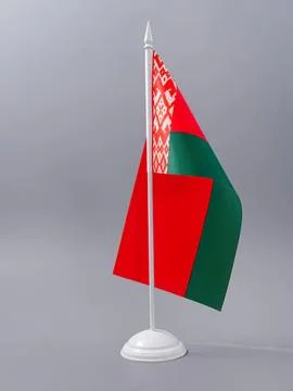 Small belarus flag on a white stand against gray sky Stock Photos