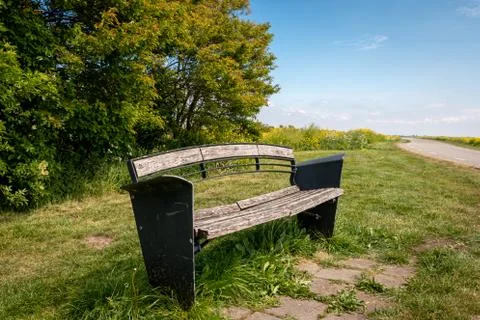Small bench to rest on the side of the road Foto stock