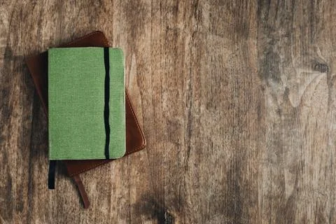 Small bible and a small notebook on a wooden texture Stock Photos