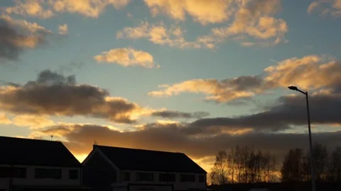 Small birds fly gracefully through bright sunset sky on calm autumn evening Stock Footage 293752808