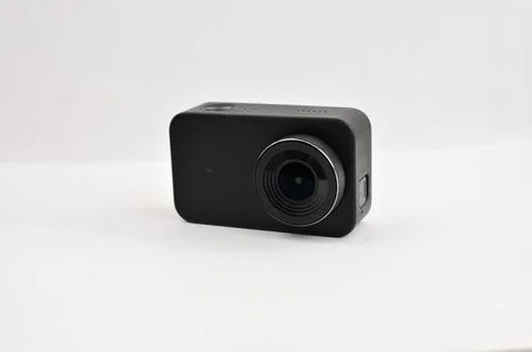 A small black 4K action camera on a table, ready to capture thrilling adven.. Fotos Stock